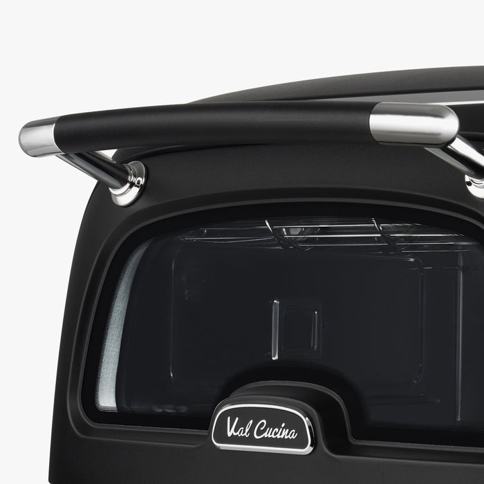 Close-up of the Val Cucina Pizza Oven door, handle and logo badge
